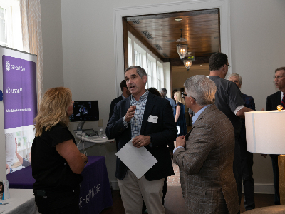 Photo of attendees socializing at UMMC OB-GYN Quality and Safety Symposium 2024